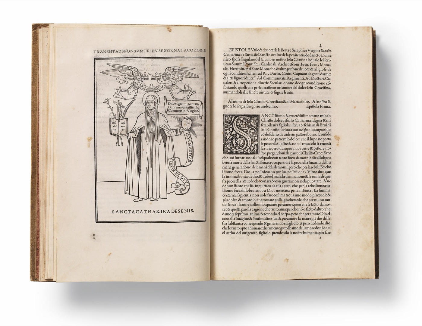 Double page ouverte d'un livre des presses aldines composé dans l'italique d'Alde, montrant une gravure sur bois de sainte Catherine de Sienne.